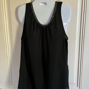 Black rayon tank top with silver gems lining the round neck line, semi sheer